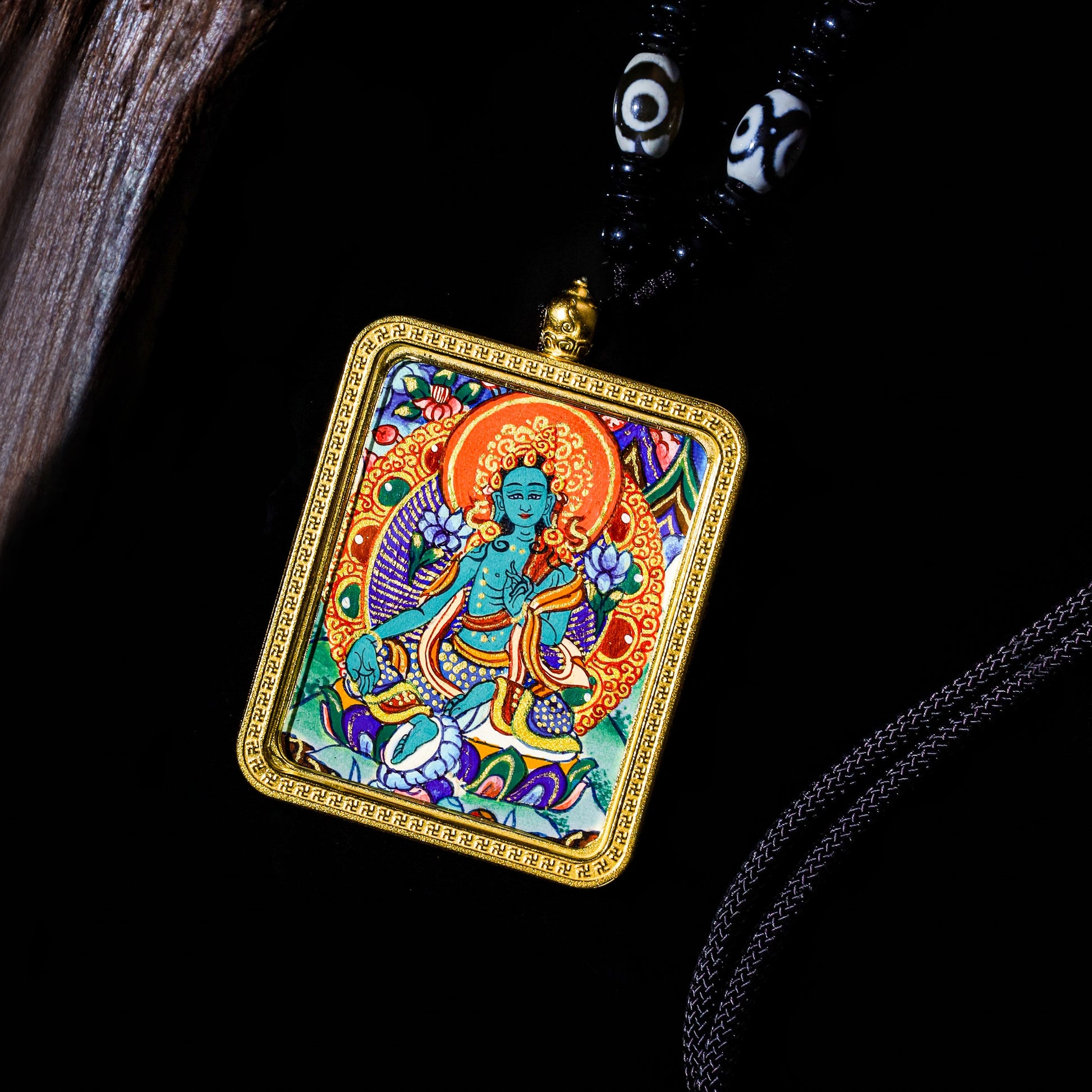 24K gold hand-painted Green Tara Thangka pendant showcasing vibrant colors and intricate details, an elegant spiritual accessory.