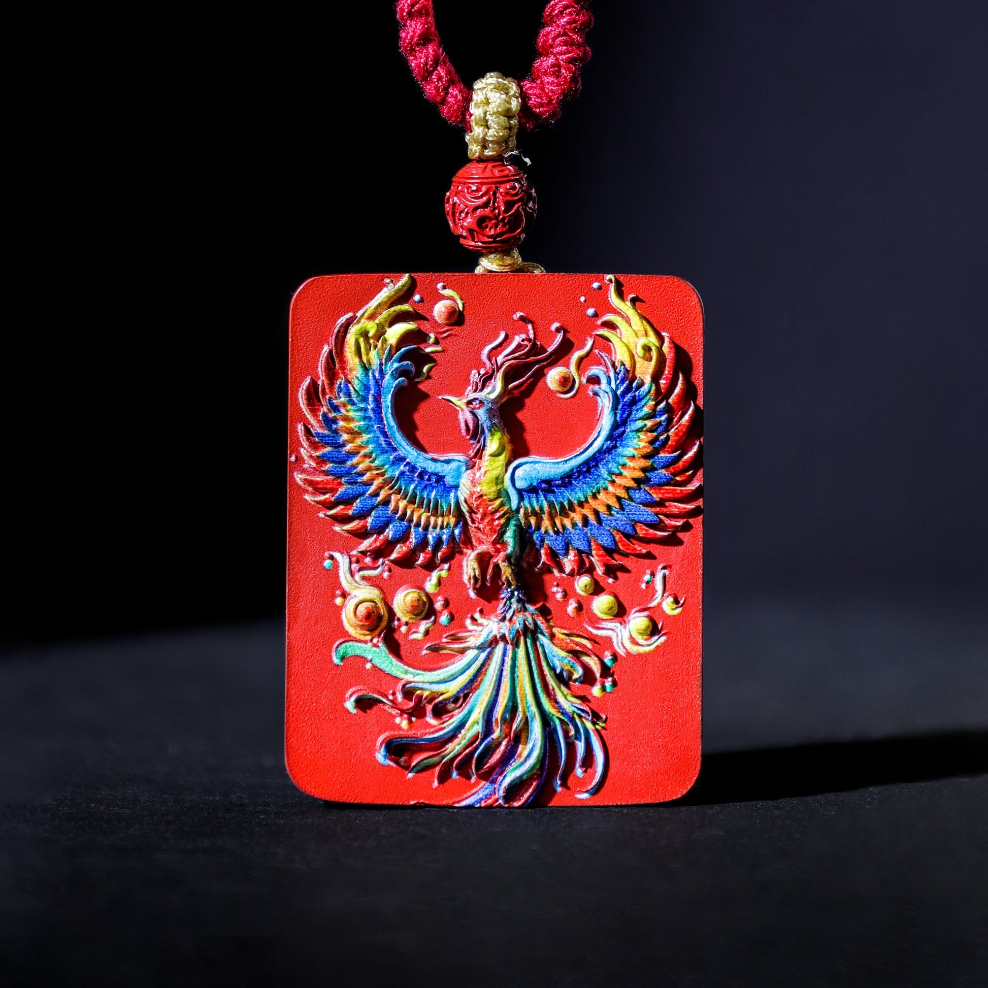 Cinnabar Fire Phoenix Thangka Pendant with vibrant colors and intricate design symbolizing rebirth and good luck.