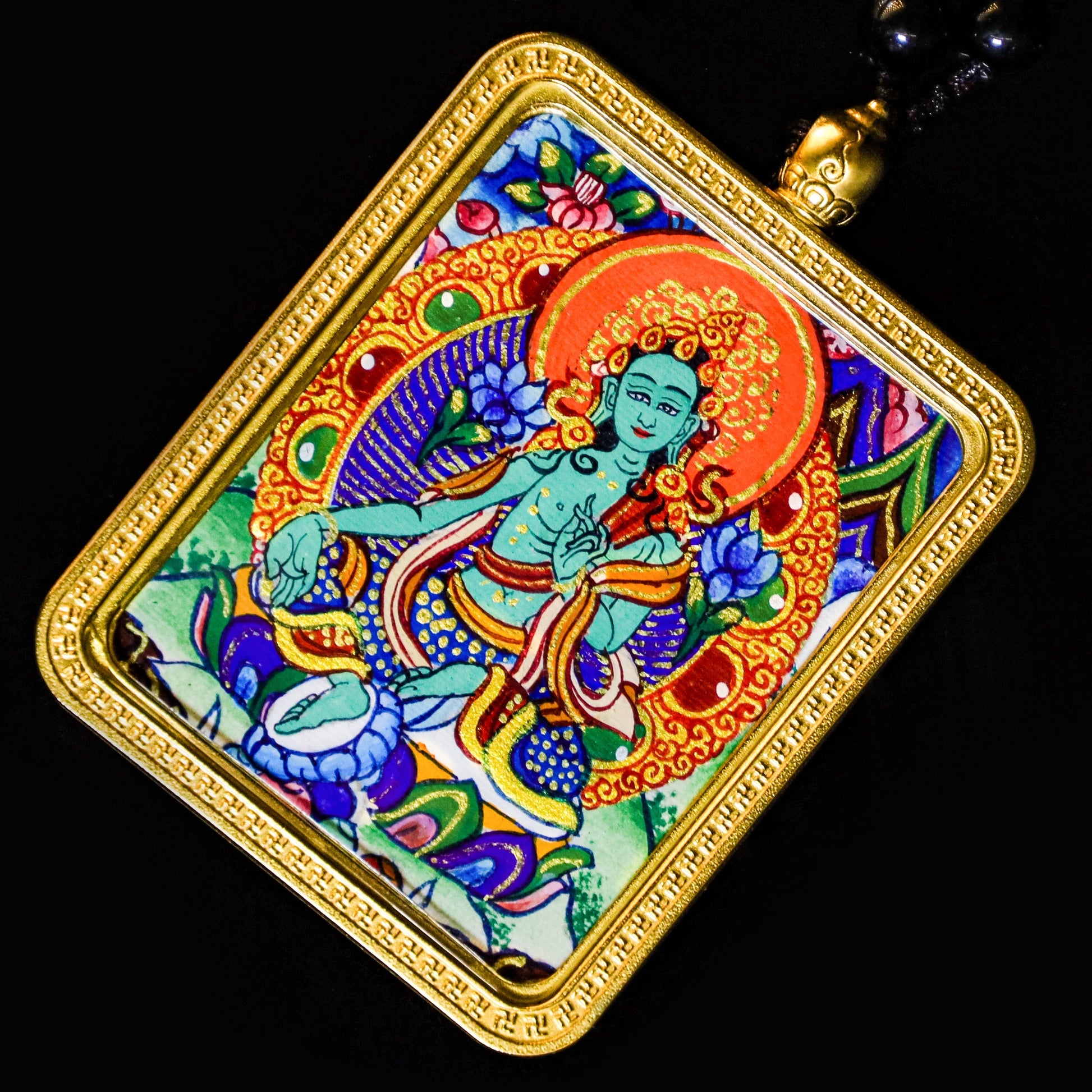 Hand-painted 24K Gold Green Tara Thangka Pendant showcasing vibrant colors and intricate details of the Green Tara deity.